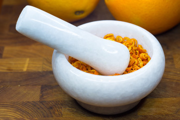 White marble mortar with the orange zest