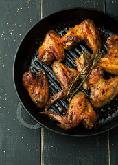 Grilled chicken wings with spices and rosemary