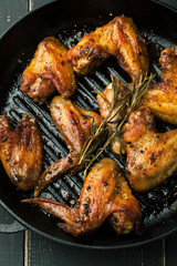 Grilled chicken wings with spices and rosemary