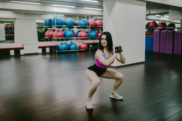 Sports girl doing squats