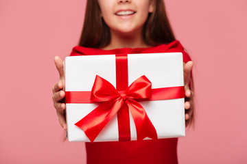 Cropped shot of smiling girl holding gift