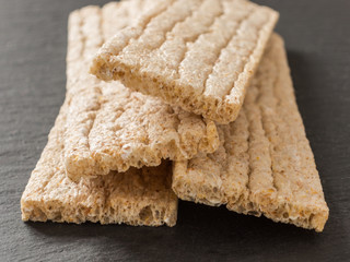 Crispbreads whole grain oat on a black background. Healthy eating. Healthy food.