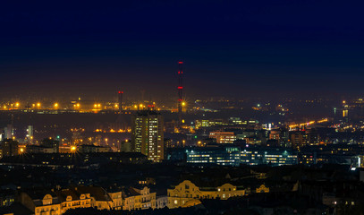 Fototapeta na wymiar City at night with urban buildings