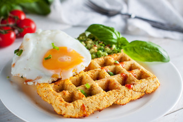 Fresh baked sweet potato waffles with ..scrambled eggs and avocado dip. Healthy breakfast