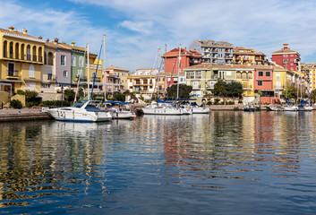 Fototapeta na wymiar Sea coast with colorful houses and fishing boats.