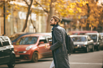 Fototapeta premium Portrait of a young bearded man wearing sunglasses
