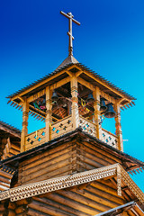Fototapeta premium The wooden dome with a cross of the old Church