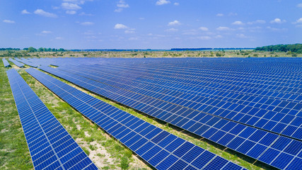 Aerial view of Solar panels. Power station. Blue solar panels. Alternative source of electricity. Solar farm. The source of ecological renewable energy.