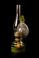 Obraz na płótnie Canvas Old antique kerosene oil lantern lamp with vintage glass chimne