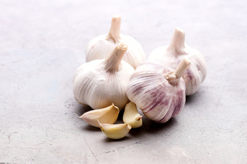 Organic Beautiful Onions and Garlic Bulbs on Background Copy Space