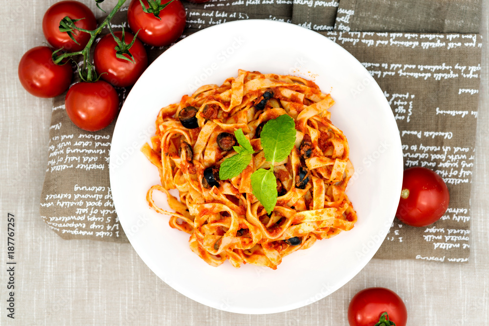 Wall mural tasty pasta italian tomato sauce pasta on the table