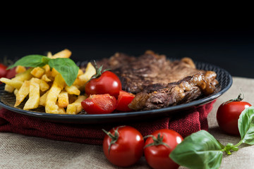 juicy steak beef meat with tomato and french fries