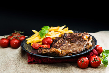 juicy steak beef meat with tomato and french fries