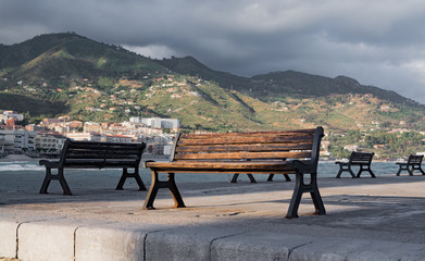 Touristic and vacation pearl of Sicily, benches in small town of Cefalu, Sicily, south Italy