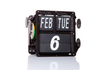 Mechanical calendar retro date 6 February, 2018 on isolated Ronald Reagan Day.