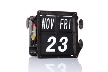 Mechanical calendar retro date 23 November, 2018 on isolated Black Friday.