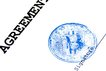 Blue stamp of virtual currency bitcoin on a loan agreement. The concept of any virtual financial...