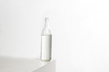 Empty colorless glass bottle