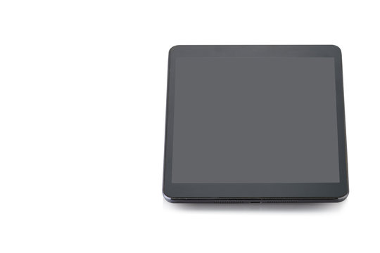 tablet computer with blank screen mockup lies on the surface, isolated on white background.  Free from copy space.