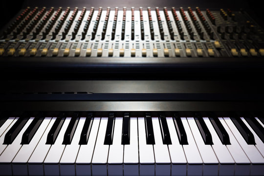 piano and sound mixer in recording studio, music background