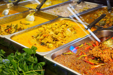 Many Thai food on tray display in the restaurant ready to eat
