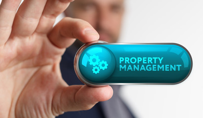 The concept of business, technology, the Internet and the network. A young entrepreneur working on a virtual screen of the future and sees the inscription: Property management