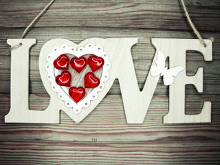 valentine's day love holiday concept hearts on old wooden background