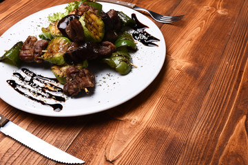 Traditional cuisine concept. Roasted pork and grilled vegetables