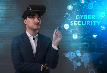 Business, Technology, Internet and network concept. Young businessman working on a virtual screen of the future and sees the inscription: Cyber security