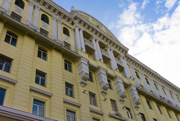 Fototapeta na wymiar The Baroque building is painted yellow