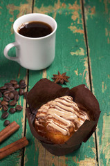 Muffin with cream and coffee