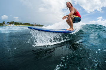 Surfer rides the ocean wave