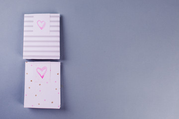 envelopes with pink hearts with gifts for St. Valentine's Day - the concept of the holiday, copy space