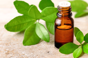 Petitgrain essential oil on the wooden board