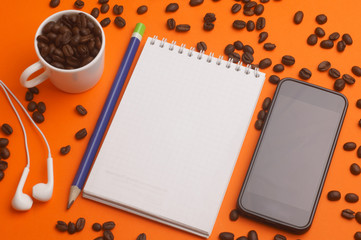 Plans for 2018, notepad, phonograph, headphones, pencil, coffee on an orange background