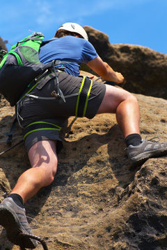Climbing man on the via ferrata