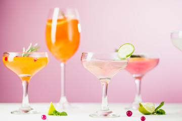 The rose exotic cocktails and fruits on pink