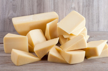 Parmesan cheese on wooden background
