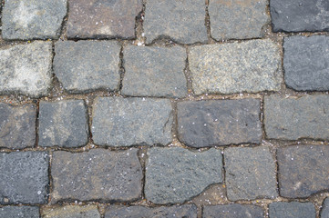 Stone pavement of dark stone, texture