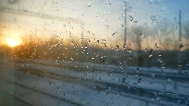 Train window winter rain