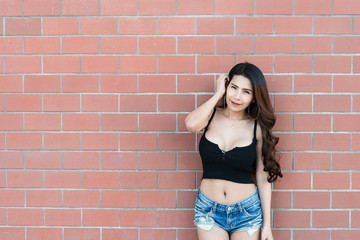 Portrait of beautiful asian woman  on brick wall background,Thailand people