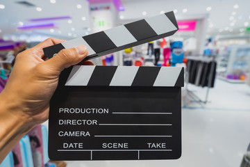 man hands holding clapper board for making video cinema in studio.Movie production clapper board or...