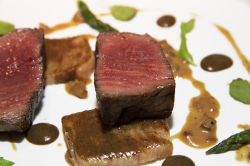 Steak of beef with sauce on a plate in a restaurant