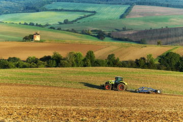 The tractor plows the fields, Moravia, Czech Republic