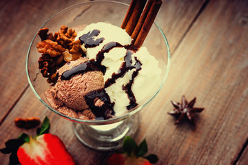 Ice cream sundae and sliced strawberry 