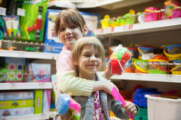 Two sisters in   toy store