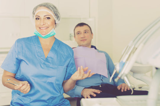 dentist female in uniform with visitor