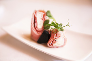 rolls of ham and cheese