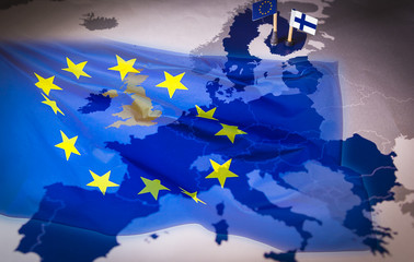 EU and Finland flags over an european union Map