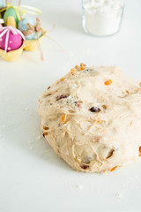 Raw dough with raisins for buns. Easter baking.